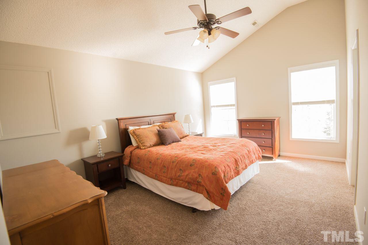 1303 Red Twig Road Apex, NC 27502 - Photo 13 of 27 Master with vaulted ceiling, large walk in closet, and en suite bathroom