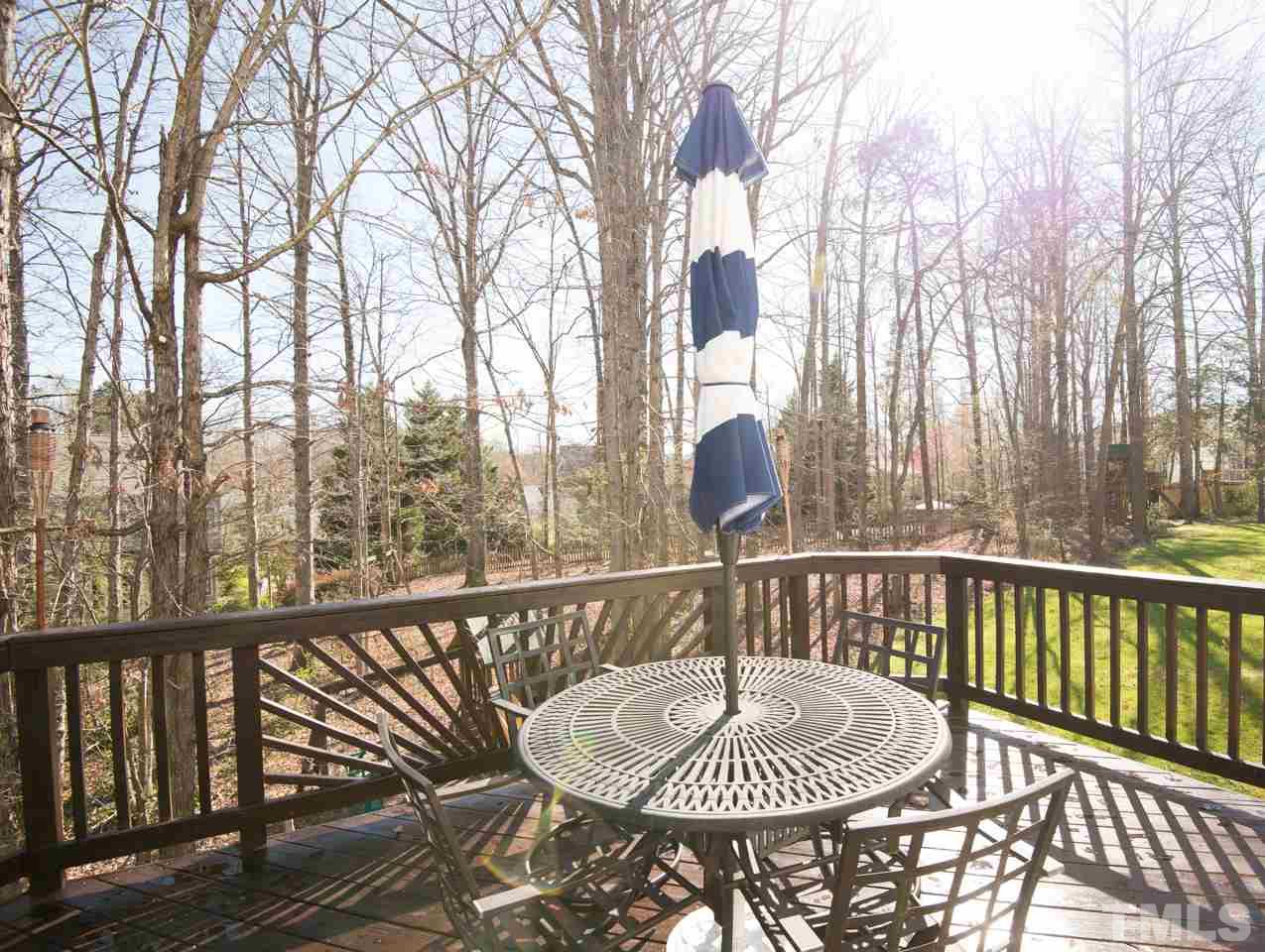 1303 Red Twig Road Apex, NC 27502 - Photo 18 of 27 great deck overlooking a wooded lot. Plenty of room for privacy and outdoor fun.