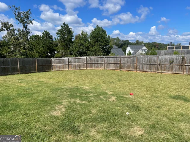 a view of a dinning table and chairs in the patio