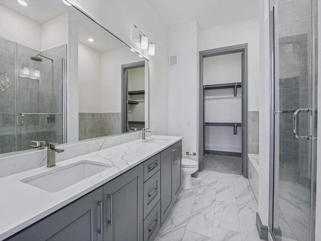 2700 Old Denton Road, Unit 4427 Carrollton, TX 75007 - Photo 14 of 25 a bathroom with a sink double vanity and a mirror