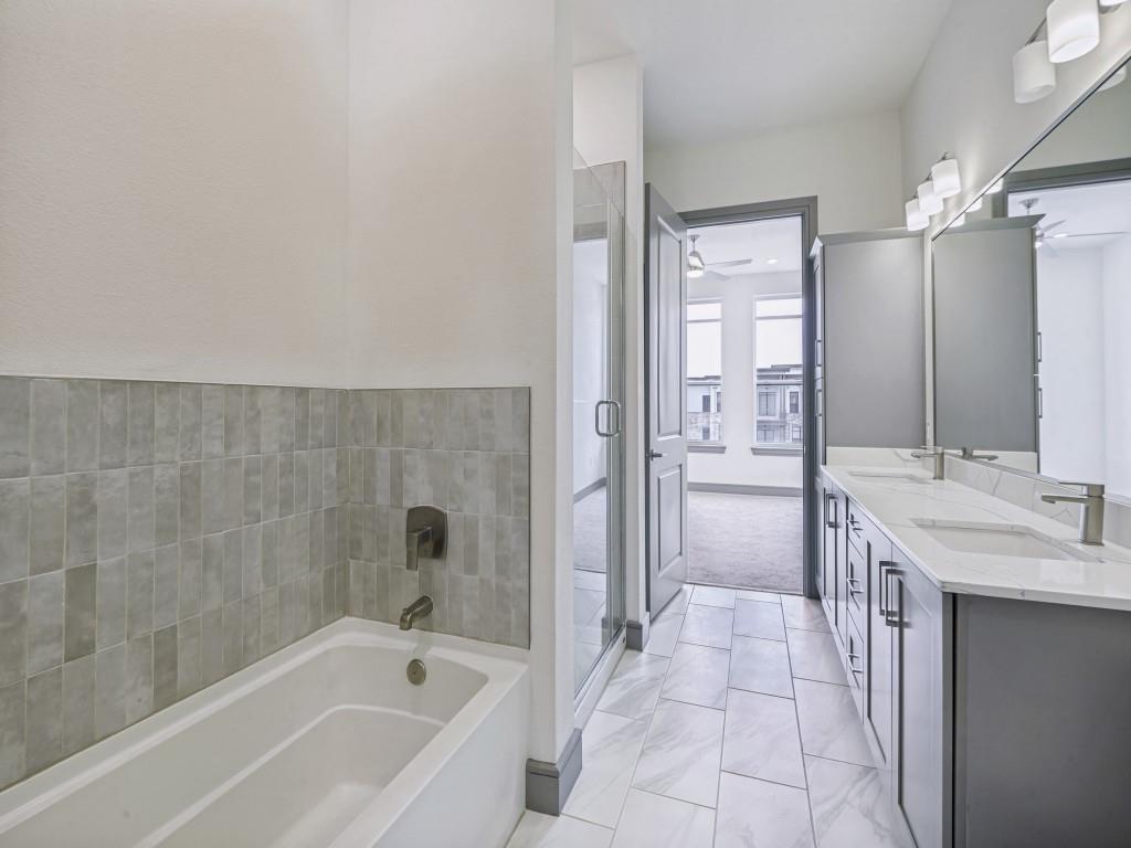 2700 Old Denton Road, Unit 4427 Carrollton, TX 75007 - Photo 16 of 25 a bathroom with a bathtub and a sink