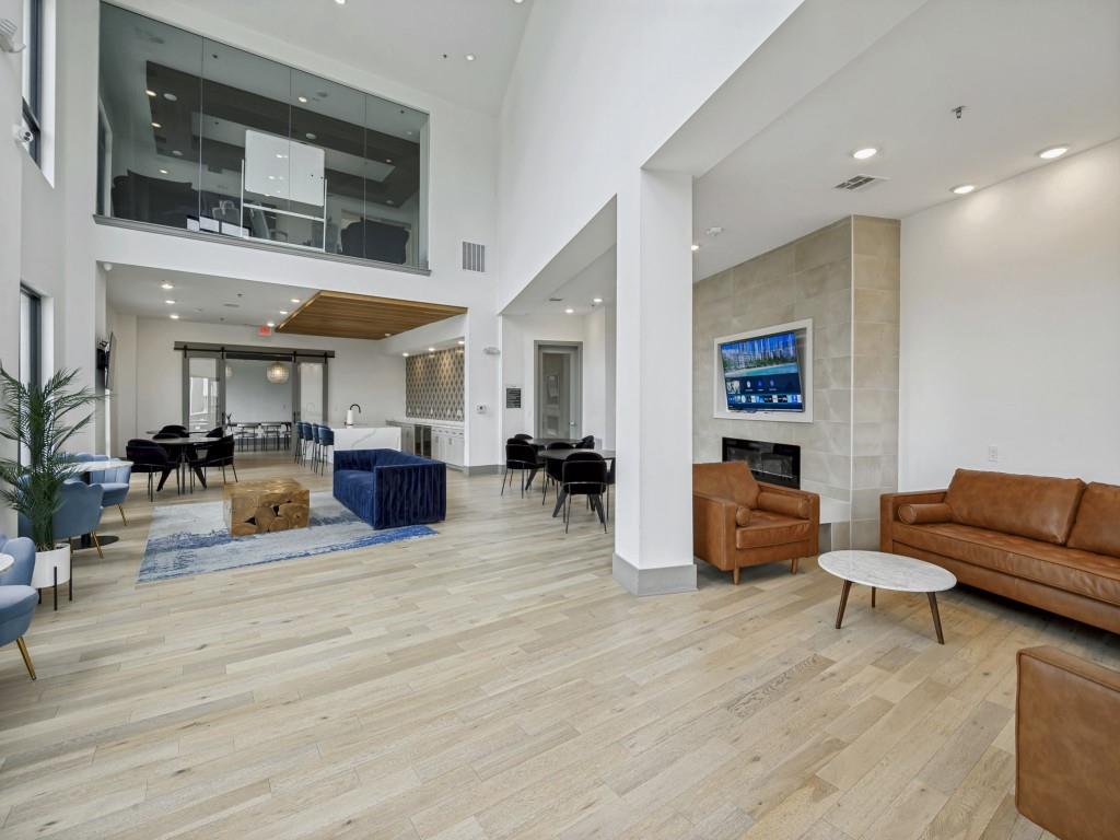 2700 Old Denton Road, Unit 4427 Carrollton, TX 75007 - Photo 20 of 25 a living room with furniture and wooden floor
