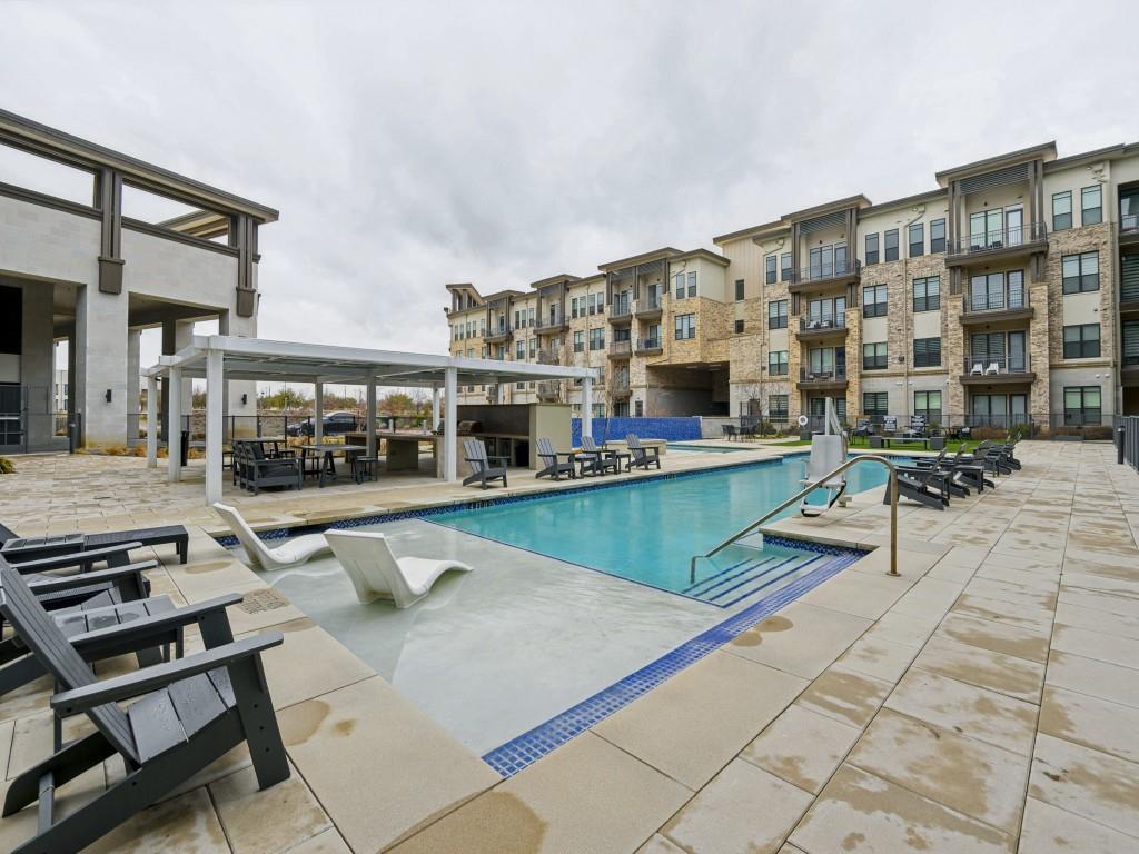2700 Old Denton Road, Unit 4427 Carrollton, TX 75007 - Photo 23 of 25 a view of a swimming pool with outdoor seating