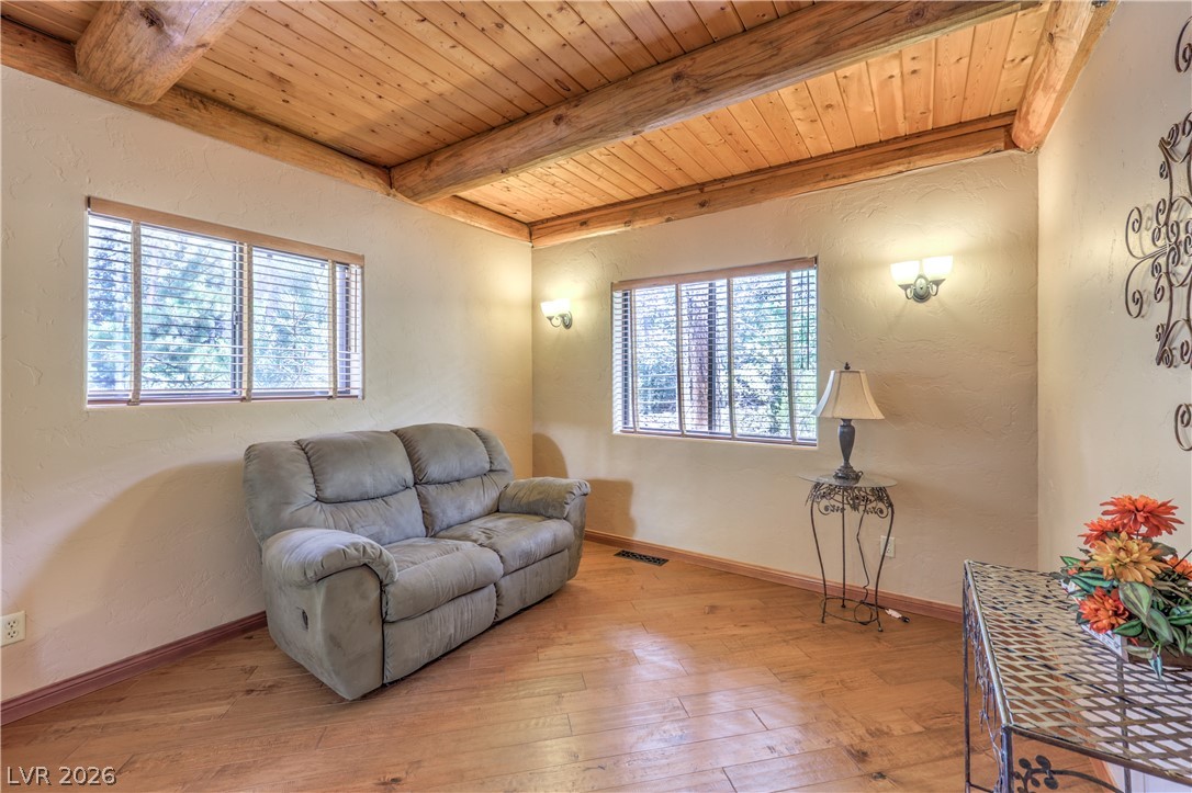 322 Ski Trail Road Mount Charleston, NV 89124 - Photo 33 of 58 Rich wood plank floors and a rustic beamed ceiling define this warm living space.