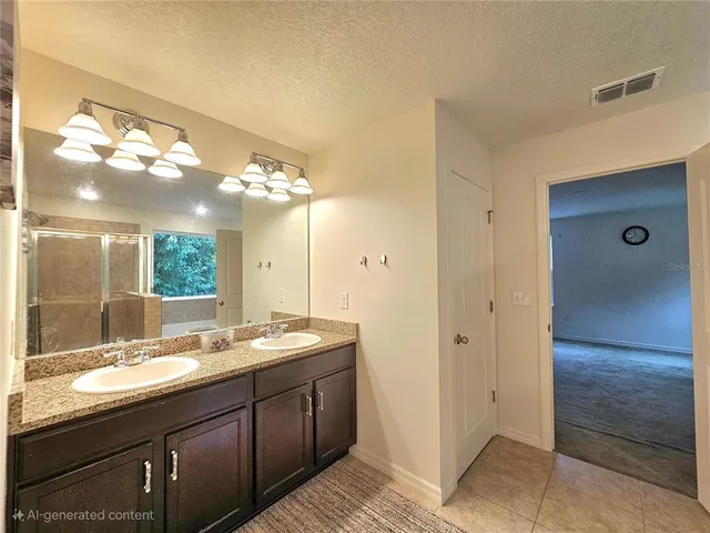 a bathroom with a granite countertop sink shower and a mirror