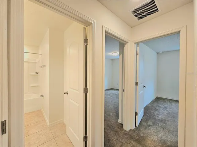 a view of a bathroom with a glass door