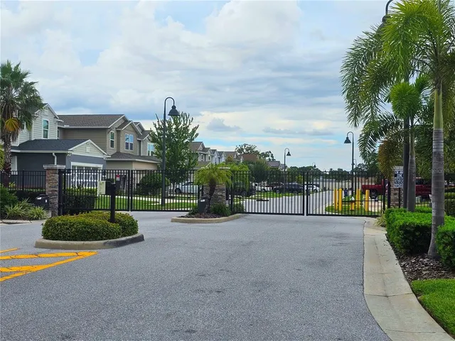 a view of sign board with flower around