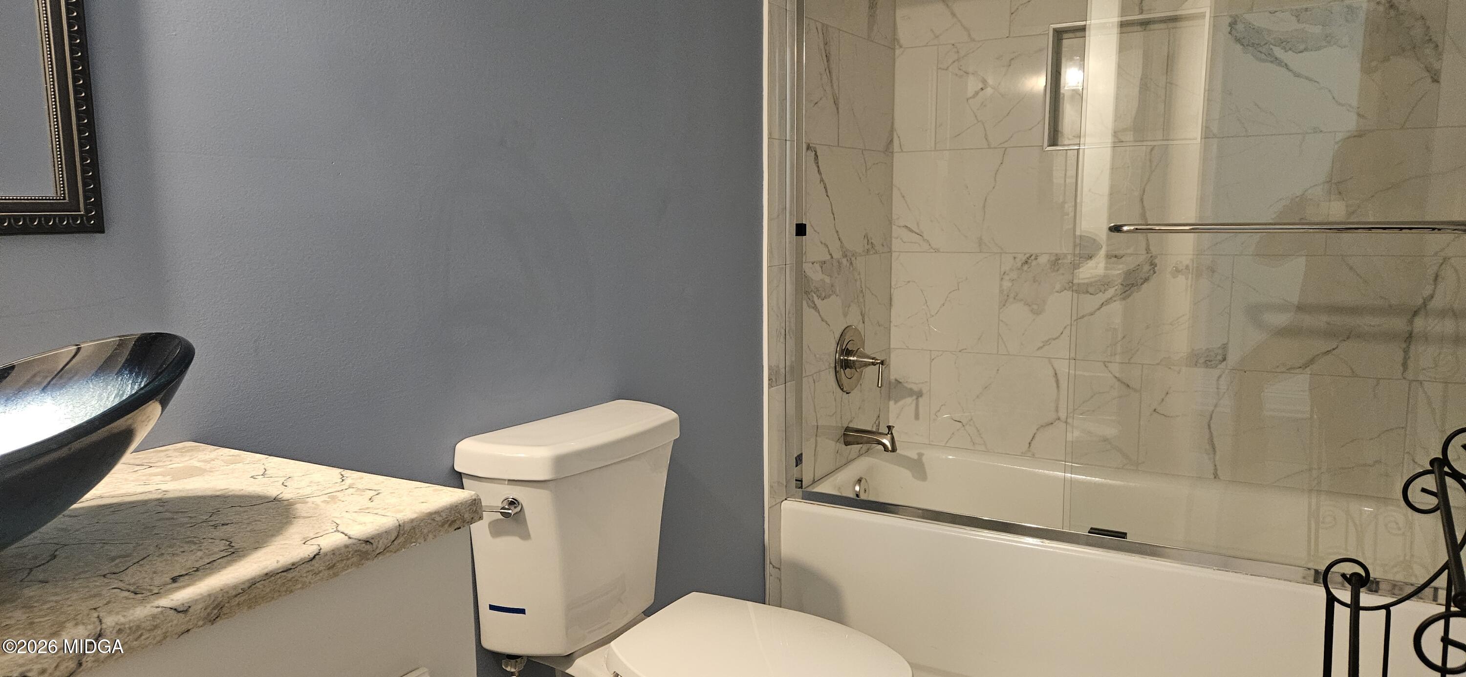 29 Dolly Lane Macon, GA 31217 - Photo 12 of 16 a white toilet sitting next to a bath tub