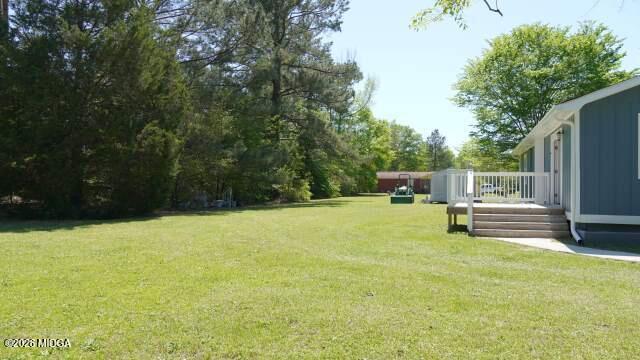 29 Dolly Lane Macon, GA 31217 - Photo 4 of 16 a swimming pool with wooden fence