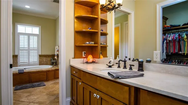 a view of a field with a tree in the background