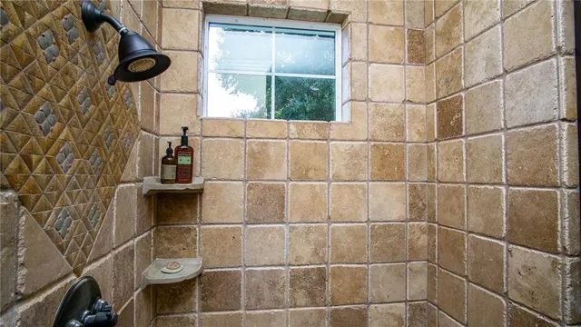 a view of a street with a house in the background