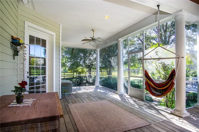a bedroom with furniture and a lamp