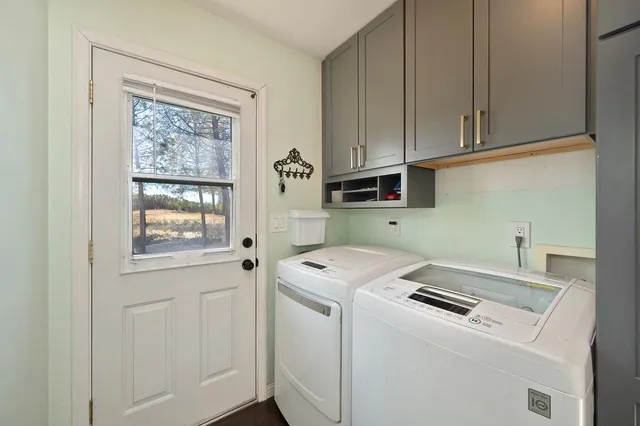 a front view of a house with a yard table and chairs