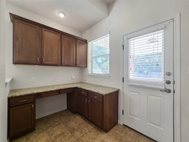 a kitchen with a sink and cabinets