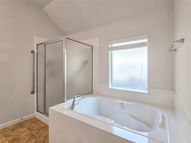 a white bath tub sitting next to a white sink