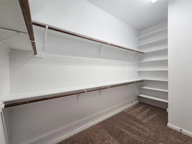 a view of an empty walk in closet