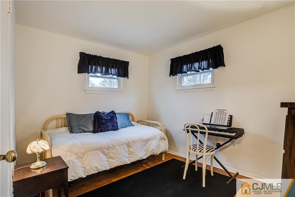 180 North Hill Road Colonia, NJ 07067 - Photo 22 of 30 a bedroom with a bed and a desk