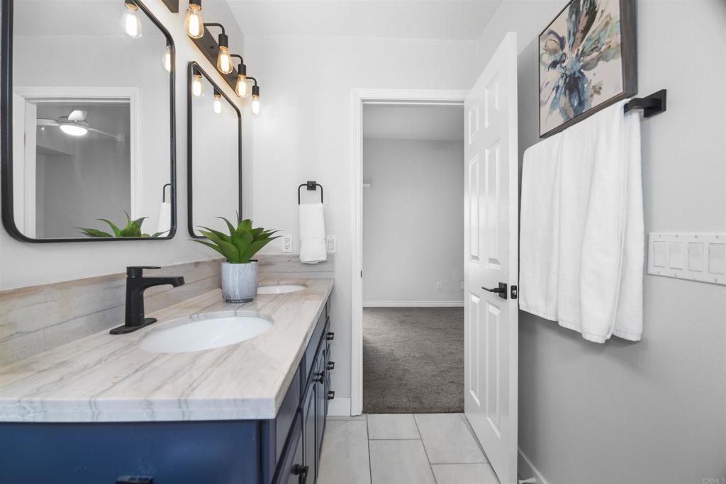 178 Elder Avenue Imperial Beach, CA 91932 - Photo 16 of 26 a bathroom with a sink and a mirror