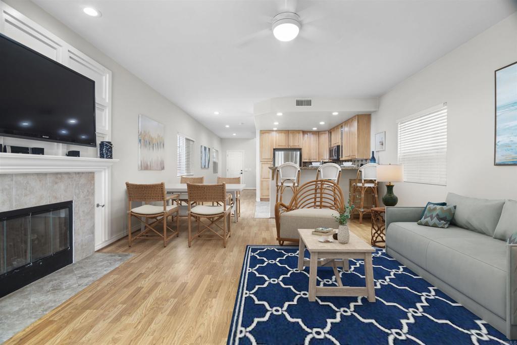 178 Elder Avenue Imperial Beach, CA 91932 - Photo 5 of 26 a living room with furniture a flat screen tv and a fireplace