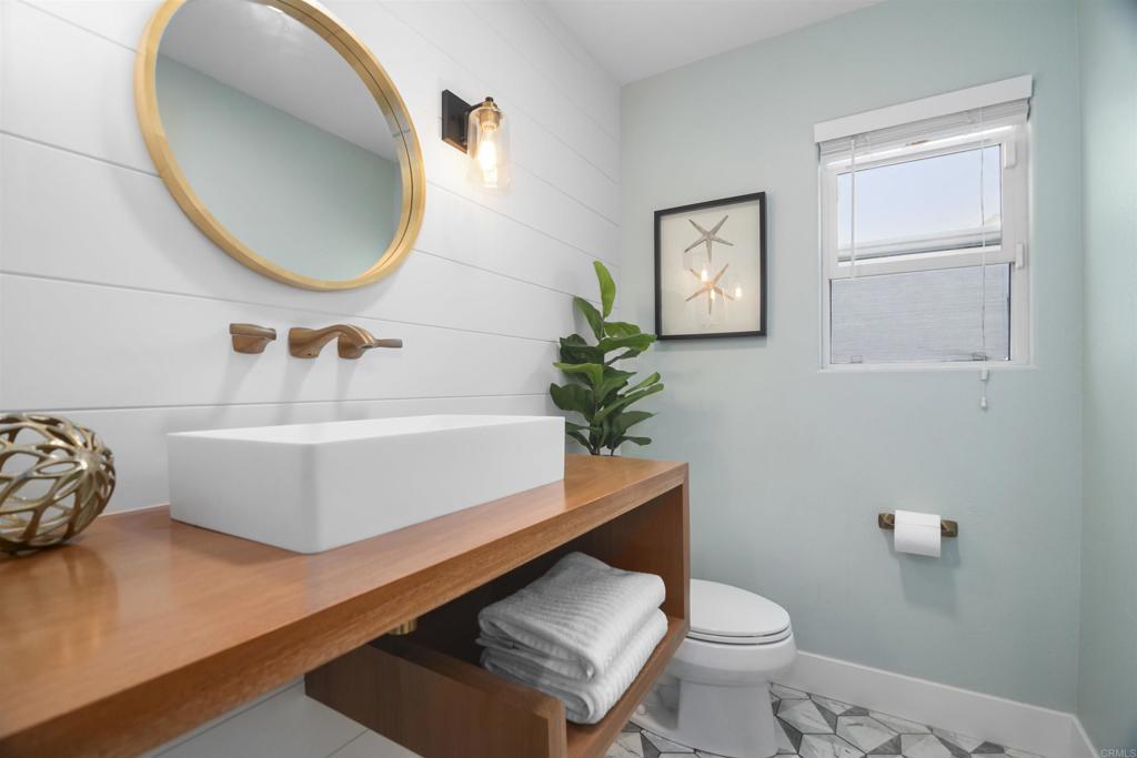 178 Elder Avenue Imperial Beach, CA 91932 - Photo 6 of 26 a bathroom with a toilet a sink and mirror
