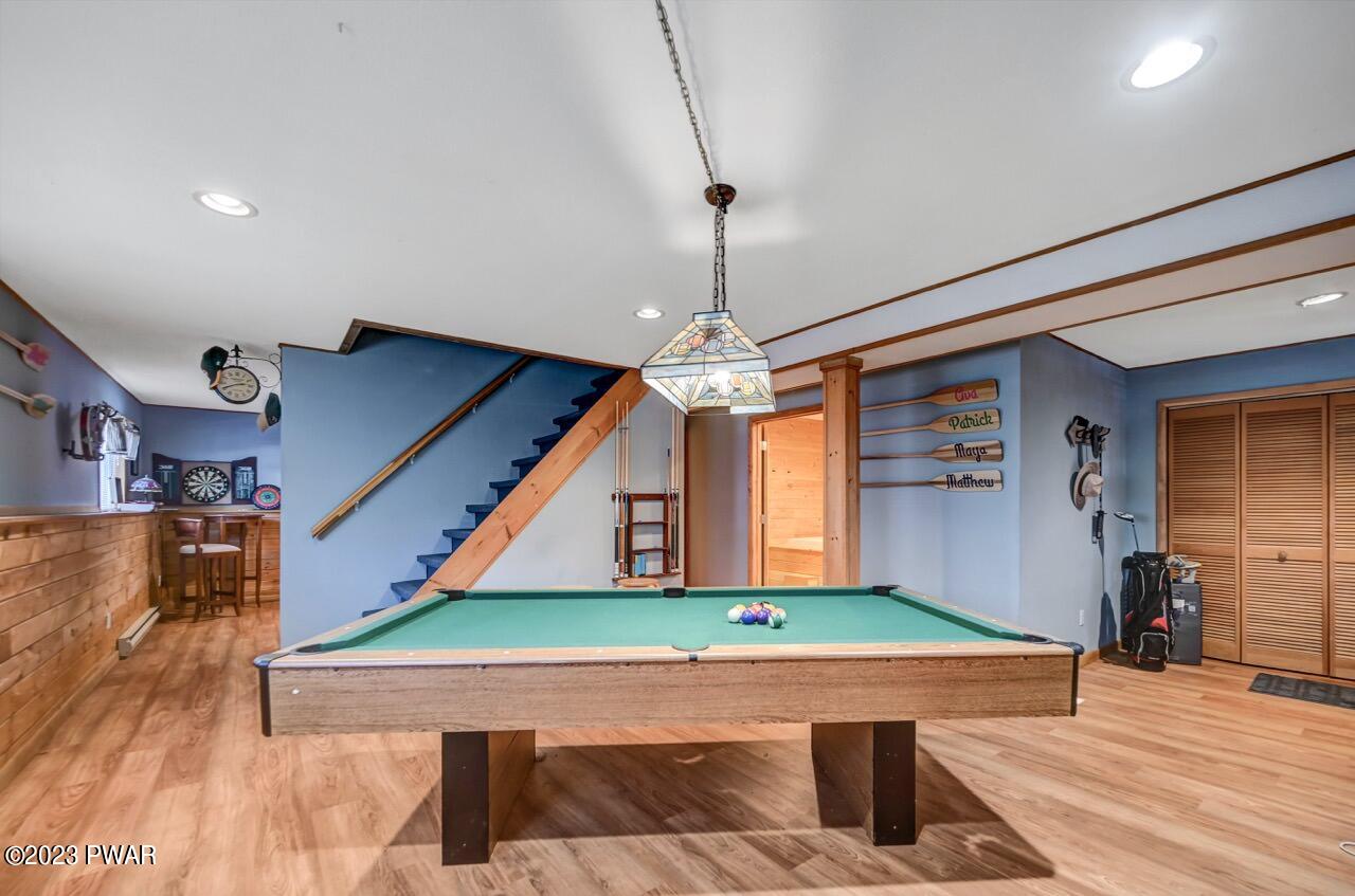 3041 Northgate Road Lake Ariel, PA 18436 - Photo 33 of 98 a room with wooden floor pool table and chairs