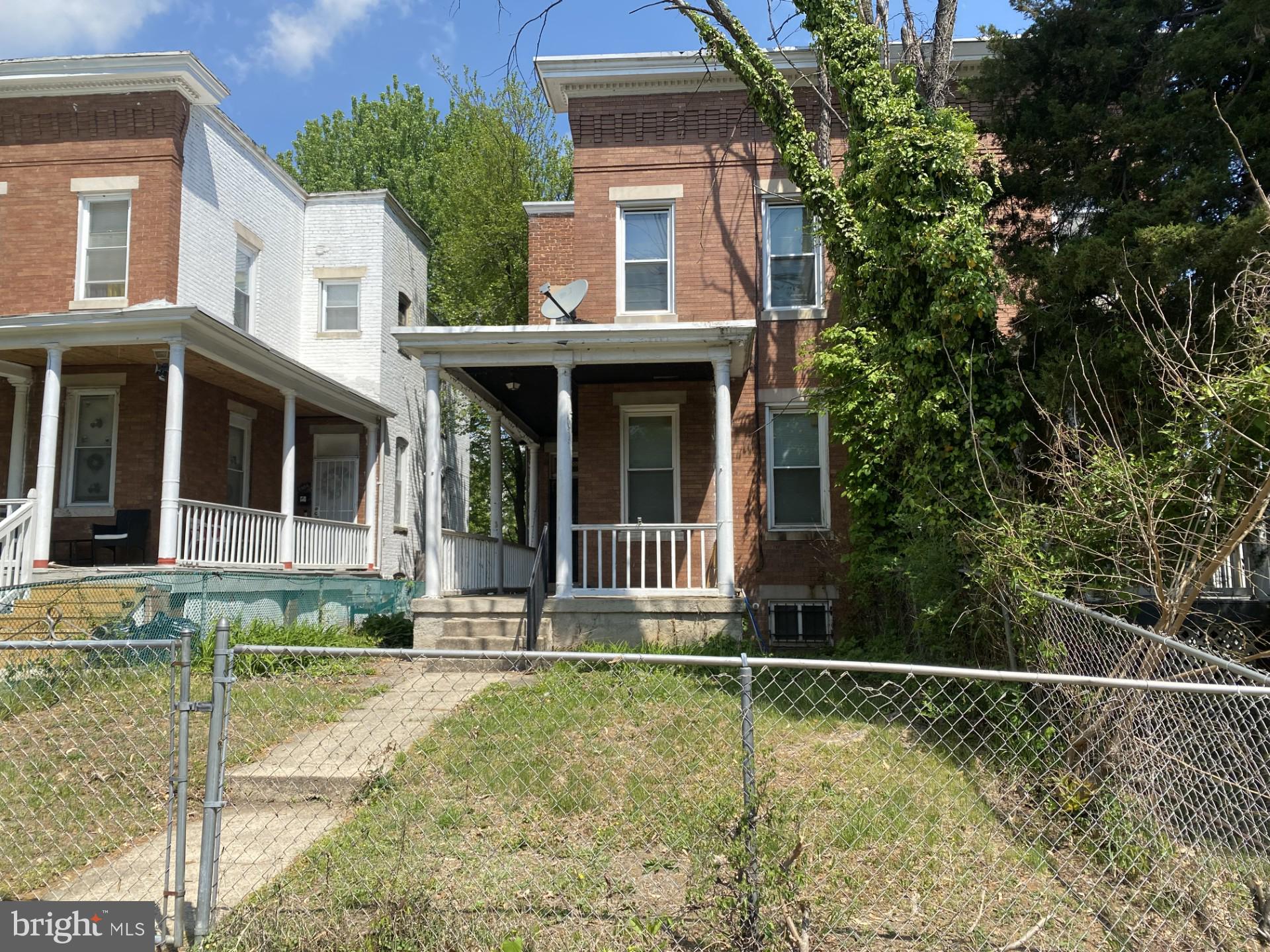 2802 Mosher Street Baltimore, MD 21216 - Photo 2 of 6 front view of a house with a yard