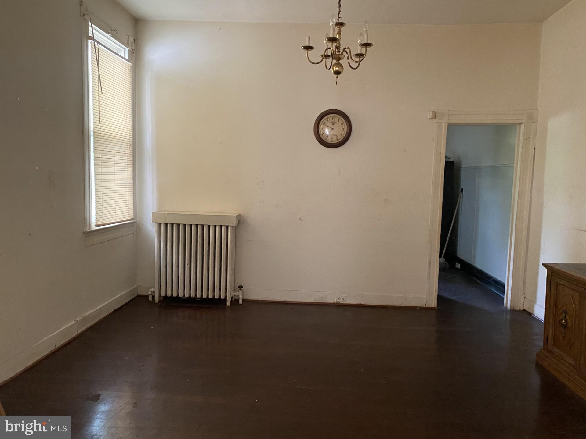 2802 Mosher Street Baltimore, MD 21216 - Photo 4 of 6 an empty room with a door
