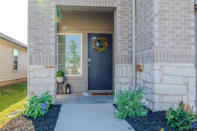a front view of a house with outdoor seating