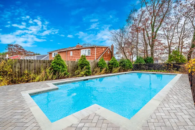 a view of swimming pool from a balcony