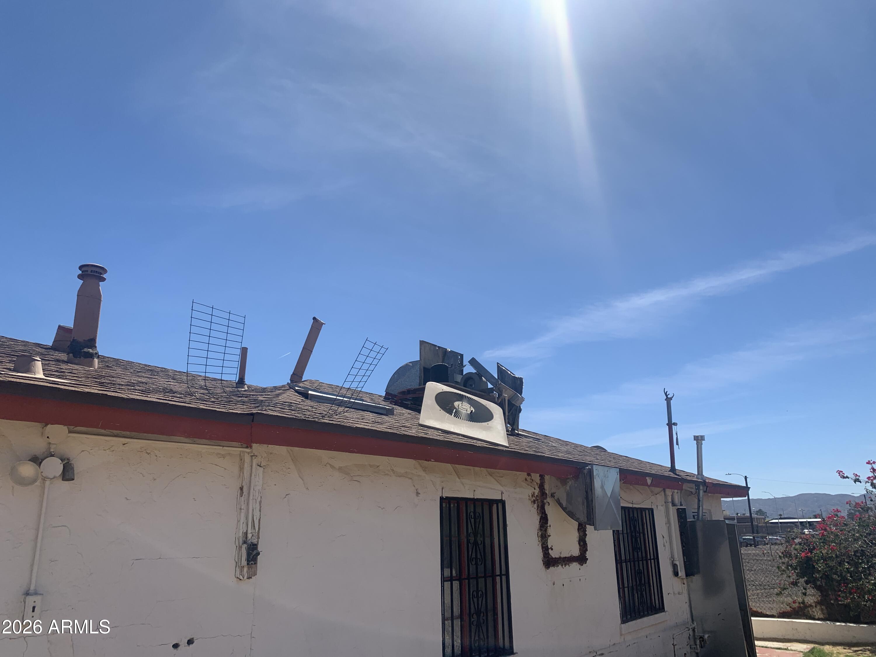 1202 South 14th Street Phoenix, AZ 85034 - Photo 12 of 44 a view of a house with roof and deck