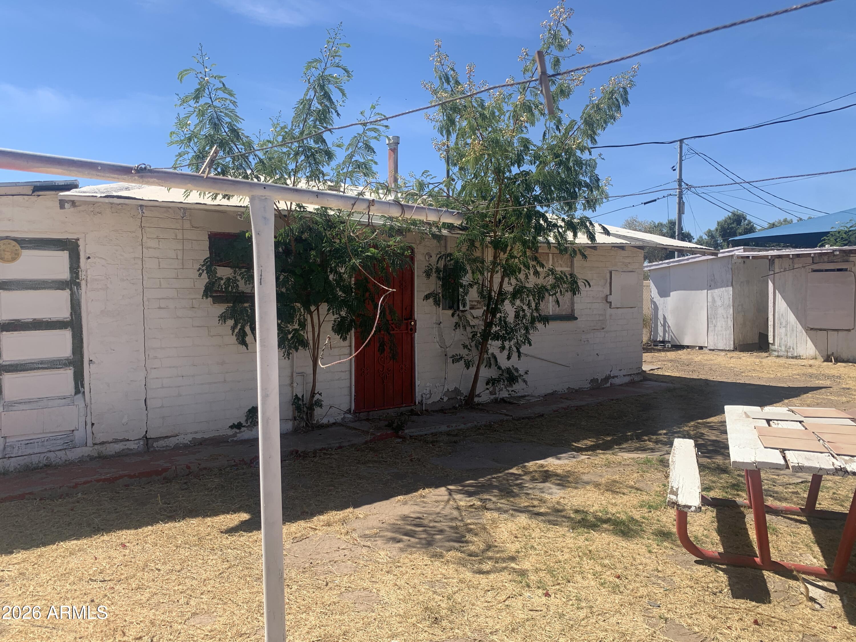 1202 South 14th Street Phoenix, AZ 85034 - Photo 13 of 44 a view of a house with a patio