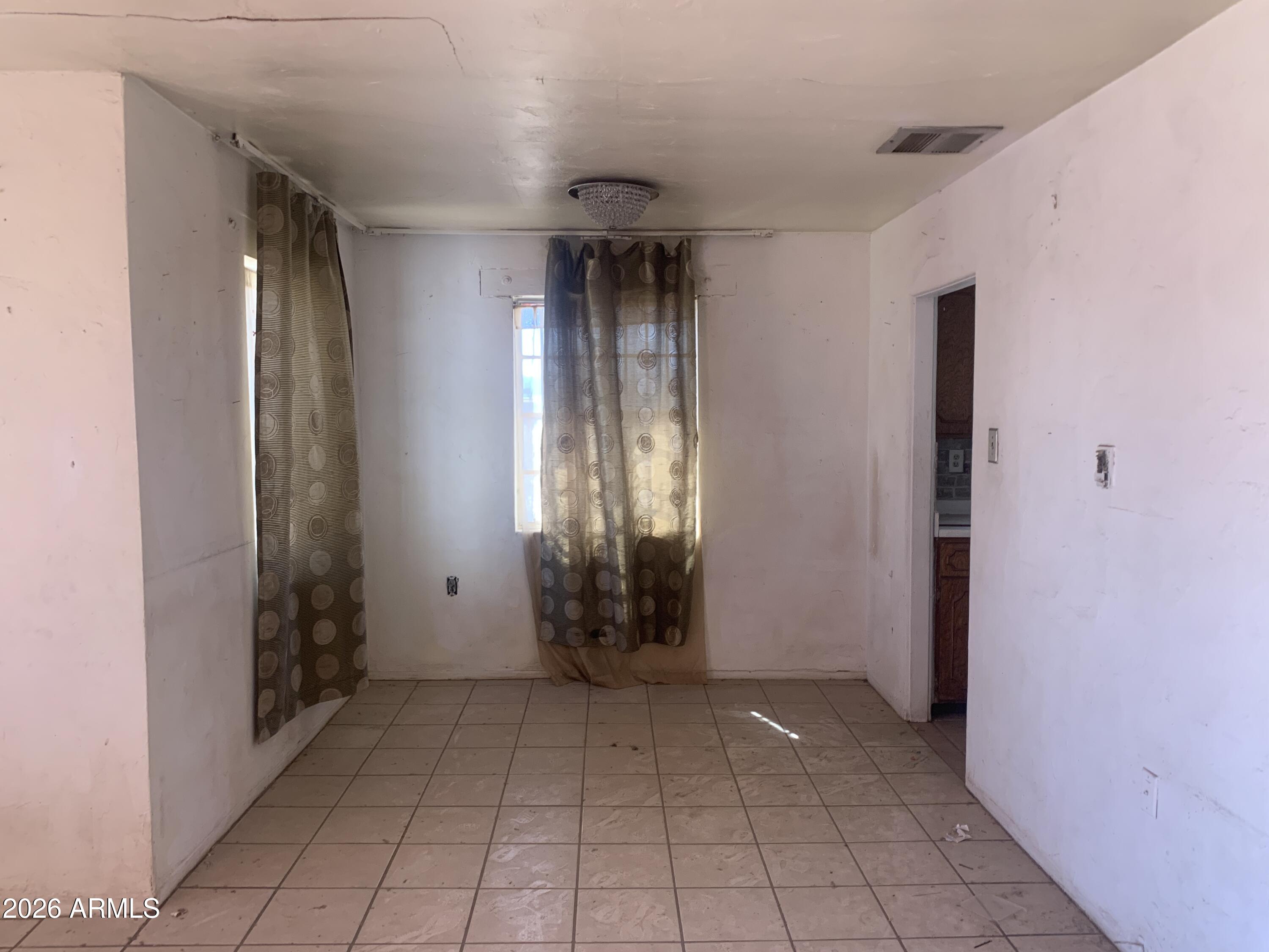 1202 South 14th Street Phoenix, AZ 85034 - Photo 28 of 44 an empty room with windows and entrance