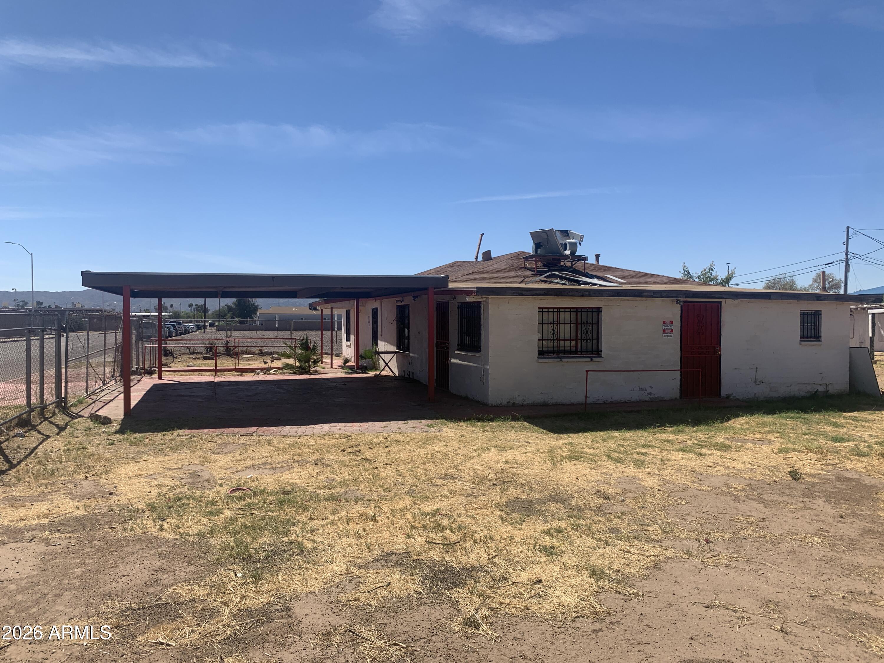 1202 South 14th Street Phoenix, AZ 85034 - Photo 8 of 44 a view of a house with a yard