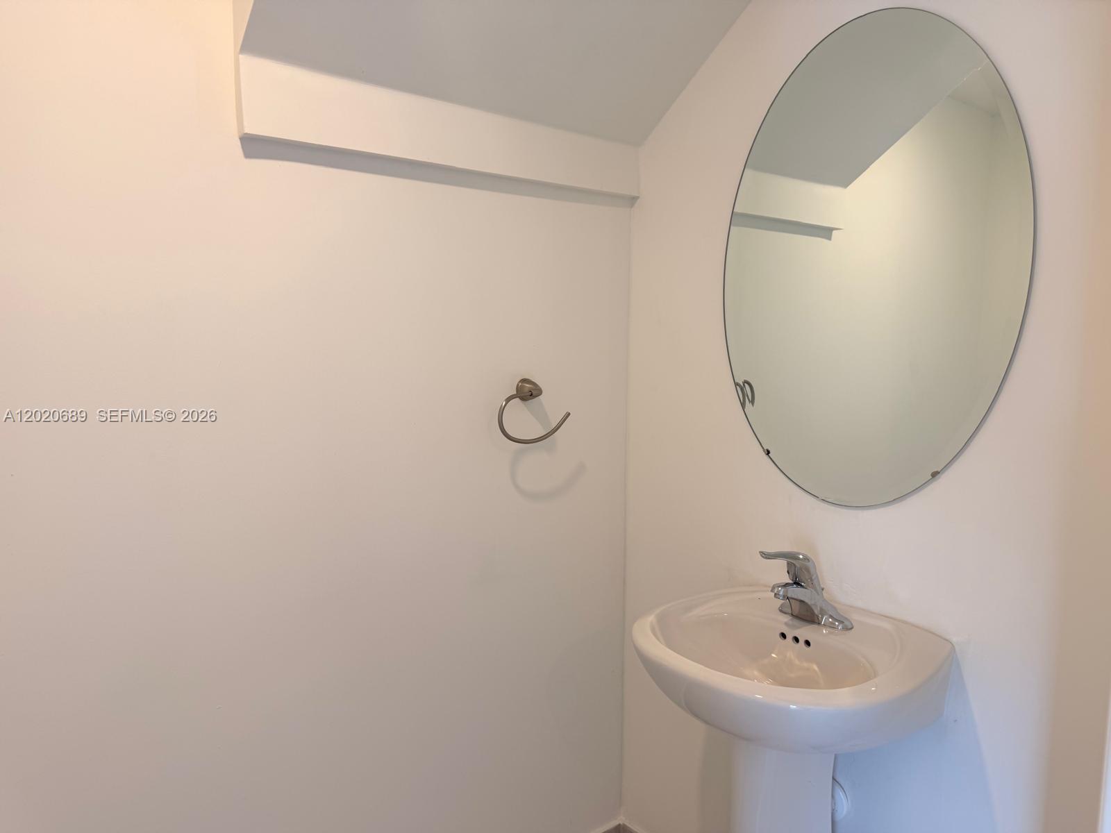 12875 Southwest 231st Terrace Miami, FL 33170 - Photo 11 of 25 a bathroom with a sink and a mirror