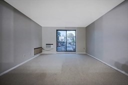 30 High Street, Unit 209 Dedham, MA 02026 - Photo 18 of 28 an empty room with windows