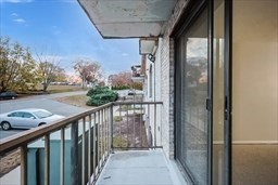 30 High Street, Unit 209 Dedham, MA 02026 - Photo 19 of 28 a view of a balcony with wooden floor