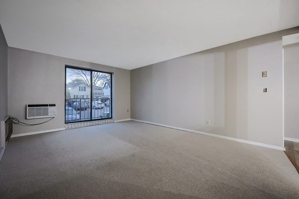 30 High Street, Unit 209 Dedham, MA 02026 - Photo 2 of 28 a view of an empty room with a window