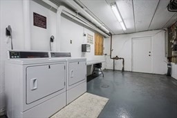 30 High Street, Unit 209 Dedham, MA 02026 - Photo 23 of 28 a kitchen with a sink and cabinets