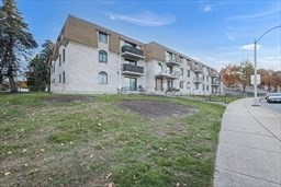 30 High Street, Unit 209 Dedham, MA 02026 - Photo 26 of 28 a view of a back yard of the house