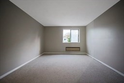 30 High Street, Unit 209 Dedham, MA 02026 - Photo 6 of 28 an empty room with windows
