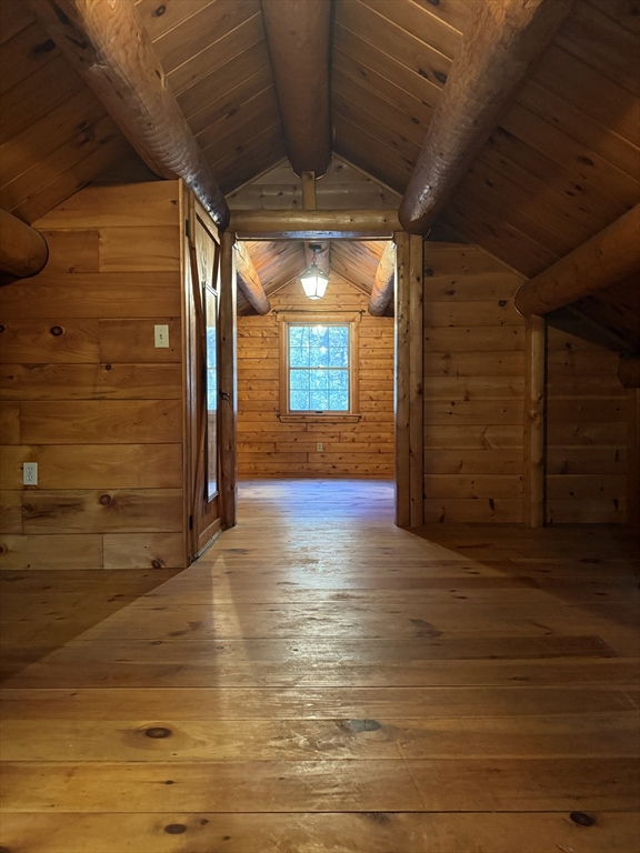 217 Nichols Road Barre, MA 01005 - Photo 22 of 41 a view of a hallway with wooden floor and a fireplace