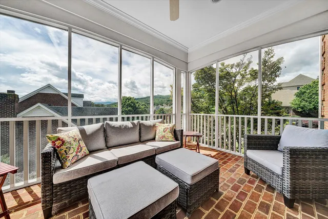 a large kitchen with lots of counter space dining table and stainless steel appliances