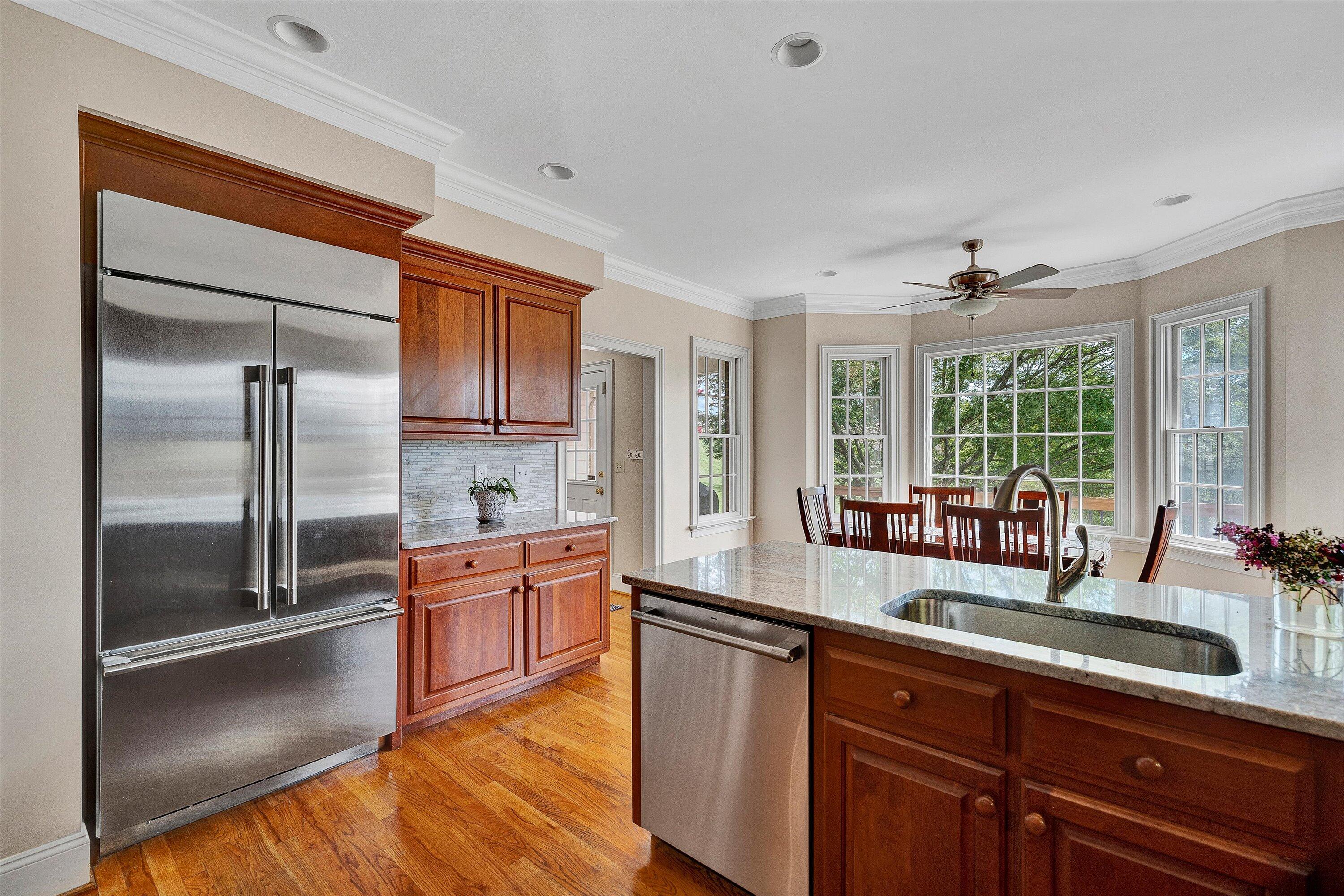 824 Pendleton Drive Salem, VA 24153 - Photo 24 of 78 a kitchen with stainless steel appliances granite countertop a refrigerator a sink a stove and island