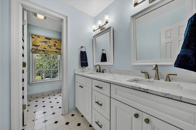 a living room with furniture a window and a fireplace