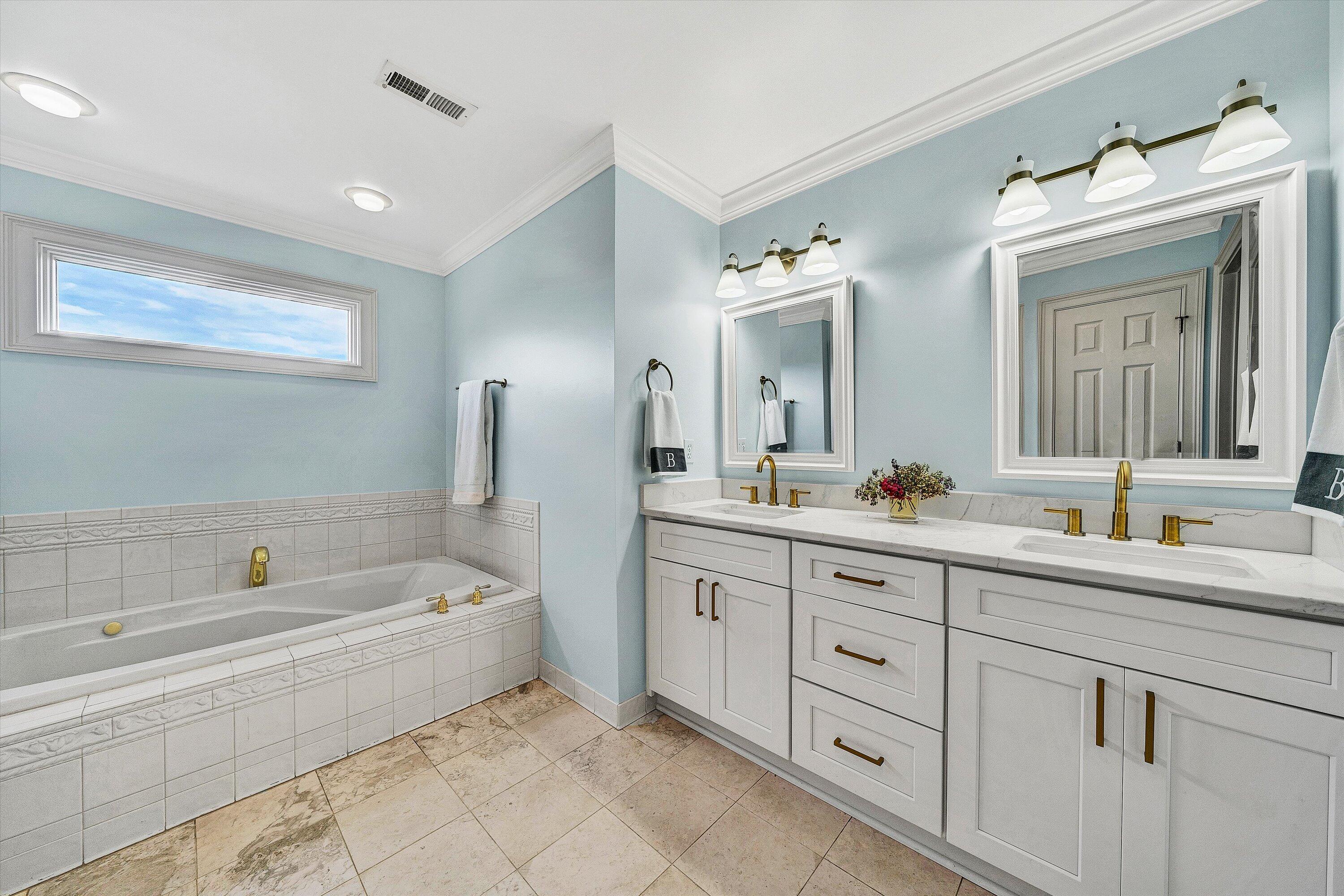 824 Pendleton Drive Salem, VA 24153 - Photo 40 of 78 a spacious bathroom with a double vanity sink mirror and bathtub