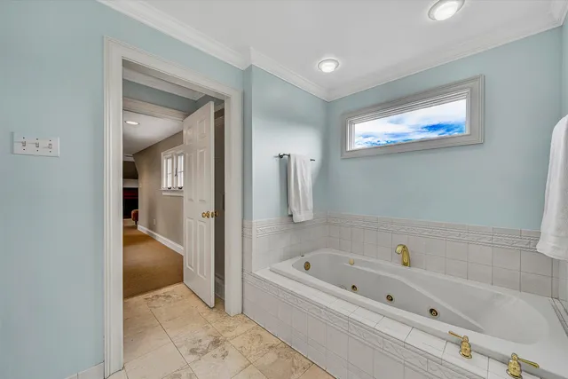 a bathroom with a granite countertop sink a toilet and a mirror