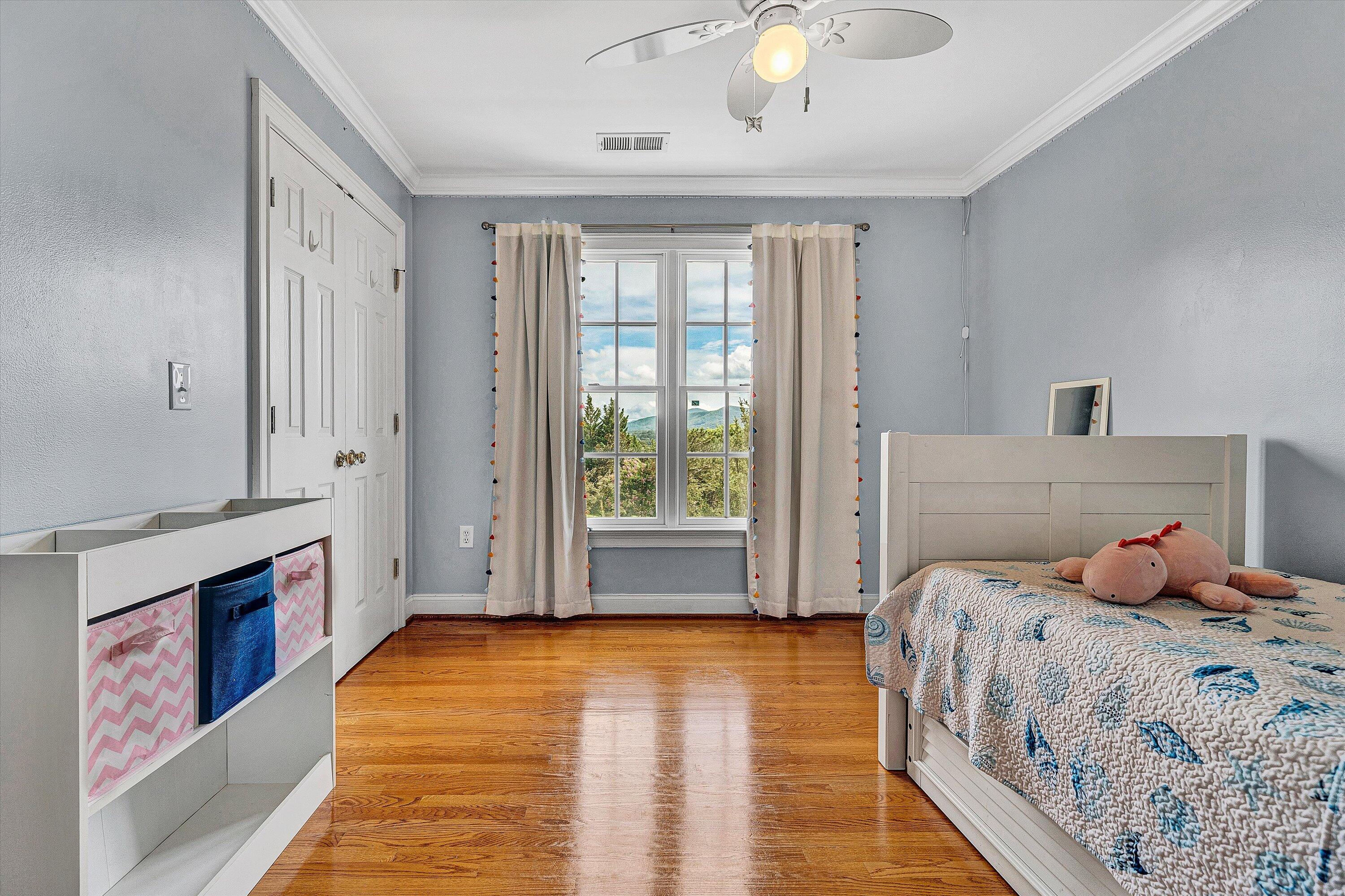 824 Pendleton Drive Salem, VA 24153 - Photo 50 of 78 a bedroom with a bed and a chandelier