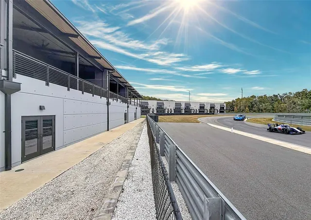 a view of a swimming pool with a yard