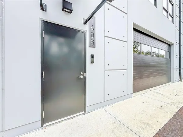 a view of an empty room with windows