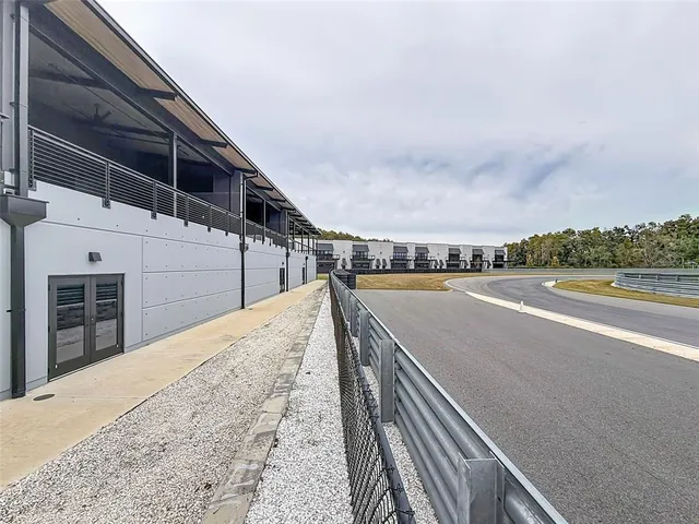 a view of a balcony with wooden floor